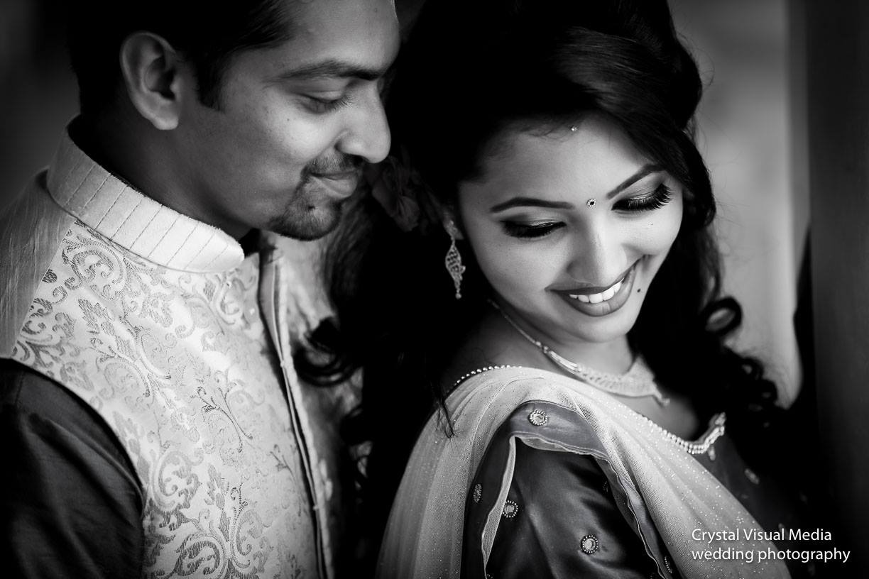 Candid photo of the bride interacting with guests at her Cherai engagement.