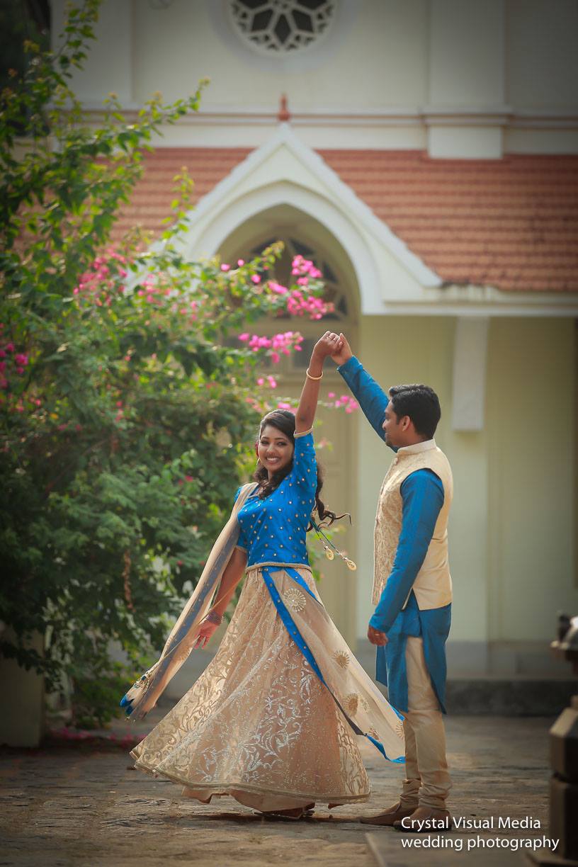 Candid photograph of the couple sharing a laugh during their engagement photoshoot in Kochi.