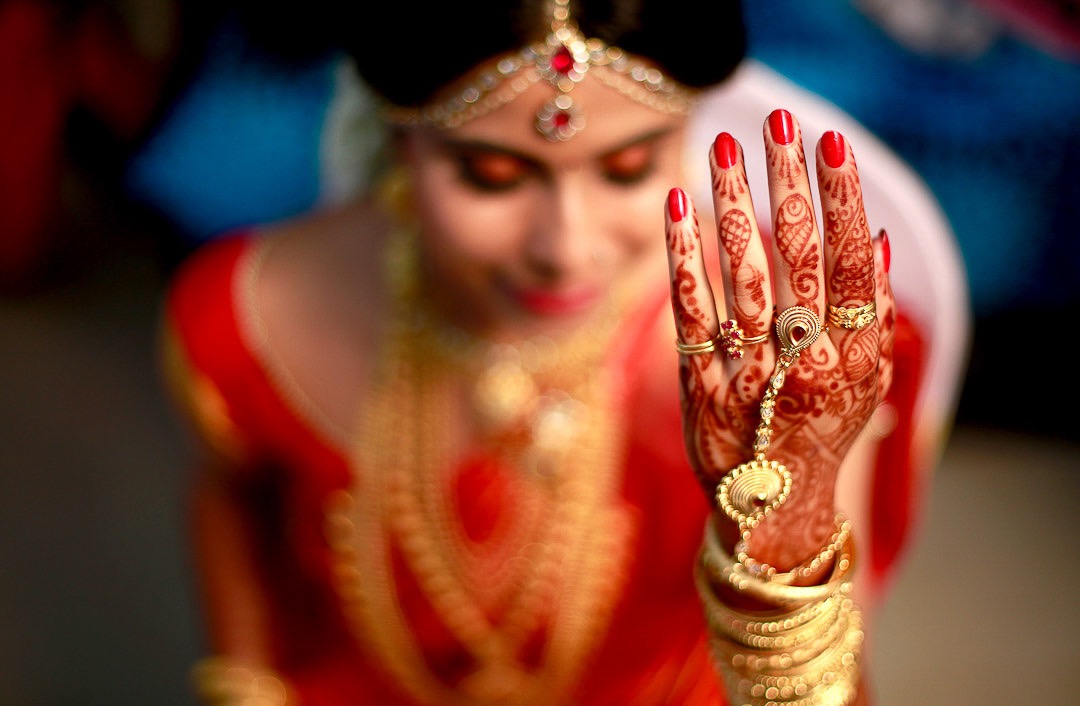 Candid portrait of a Kerala bride during wedding preparations