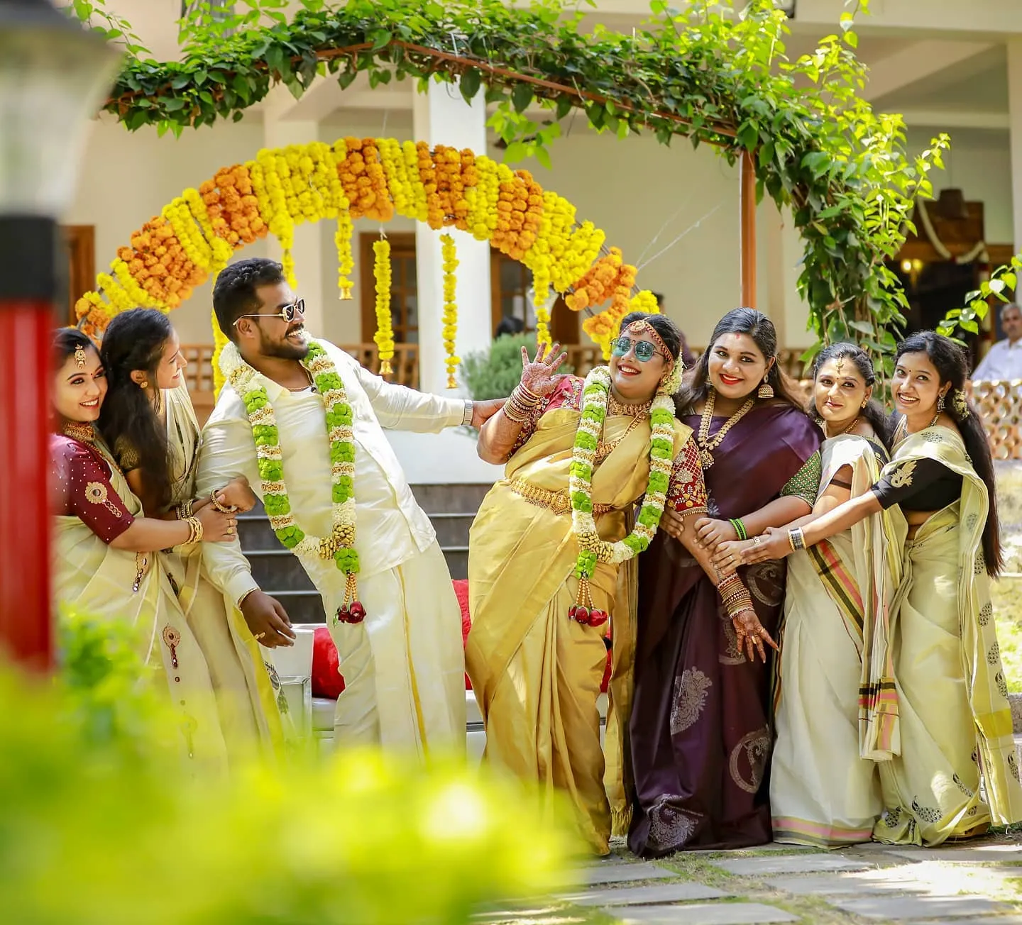 Bride Abhinaya sharing a candid laugh during her intimate Kottayam wedding.